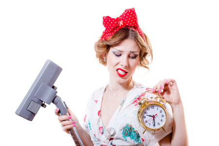 picture of surprised pinup girl beautiful blond young woman housewife holding vacuum cleaner の写真素材