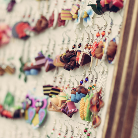 Shop display of fancy handmade bijou earrings in shape of food