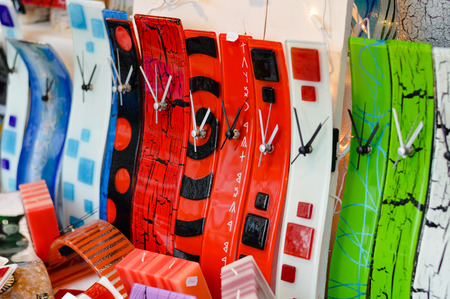 Shopping display of fashionable modern handmade glass clocksの写真素材