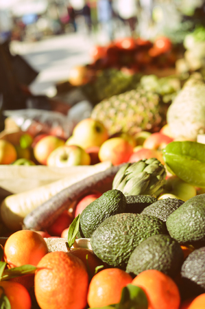 Fresh organic vegetables and fruit over the city market background