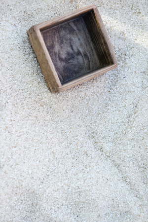 Rice grains on market stall with measure box closeup pictureの写真素材