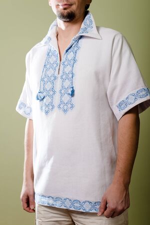 guy in Ukrainian handmade embroidered shirt posing in studioの写真素材