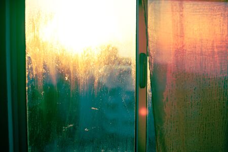 Natural condensation droplets on transparent sunshine glass background
