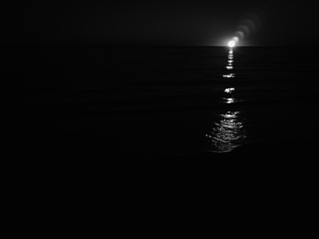 Natural sunshine over sea ocean water surface backgroundの写真素材