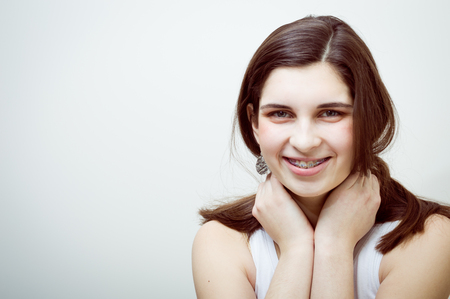 Young attractive caucasian stylish woman happy smile on studio background. Closeup portrait, trendy lifestyleの写真素材
