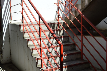 Staircase structure detail over gray concrete wall building abstract backgroundの写真素材