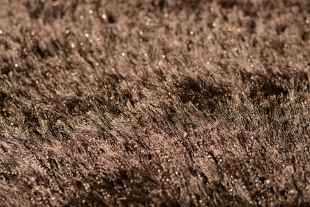 Brown carpet closeup textured sample display, empty blank copyspace interior background. Dark colorsの写真素材