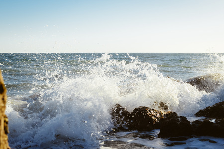 Natural sunny rocky shore outdoors seascape. Coastline abstract background