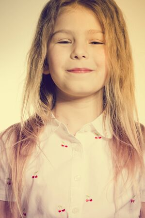 Joyful exciting girl on a light background, closeup portraitの写真素材