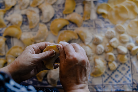 Close up of ravioli on table background tasty traditional food. Fresh dumplings cooking preparationの写真素材