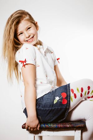 Portrait of adorable beautiful young lady looking at camera over light background. Healthy, emotional, peaceful joyful happinessの写真素材