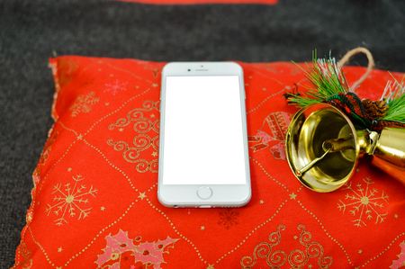 Montreal, Canada - 10 December, 2017: Closeup on Apple iPhone 8 smart phone. Digital social network mock up. Internet wireless technology, happy joyful concept: flat lay of Christmas time copyspaceのeditorial素材