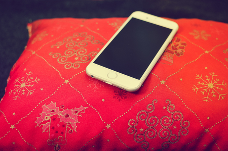 Montreal, Canada - 10 December, 2017: Closeup on Apple iPhone 8 smart phone. Digital social network mock up. Internet wireless technology, happy joyful concept: flat lay of Christmas time copyspaceのeditorial素材