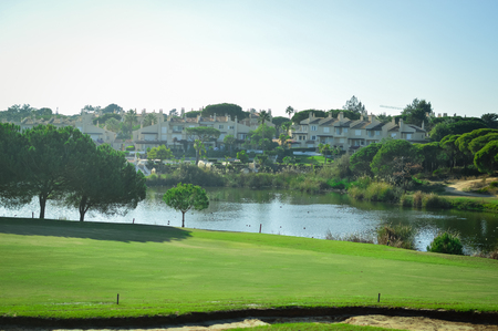 Golf field on sunny outdoors luxury lifestyle backgroundの写真素材