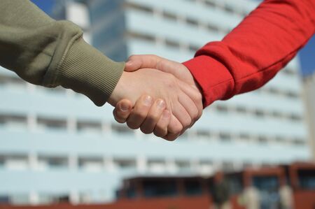Touching human hands of cheerful people on sunshine beautiful nature outdoors. Lovely valentine...