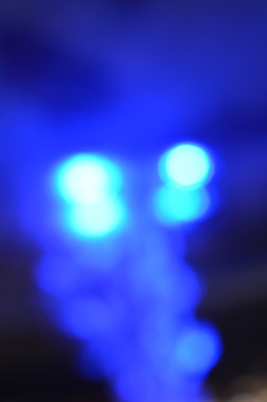 Night bokeh shiny glowing lights city street outdoors, blurred effect abstraction image backgroundの写真素材