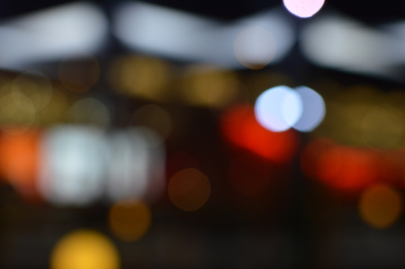 Night bokeh shiny glowing lights city street outdoors, blurred effect abstraction image backgroundの写真素材