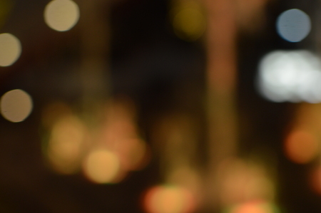 Night bokeh shiny glowing lights city street outdoors, blurred effect abstraction image backgroundの写真素材