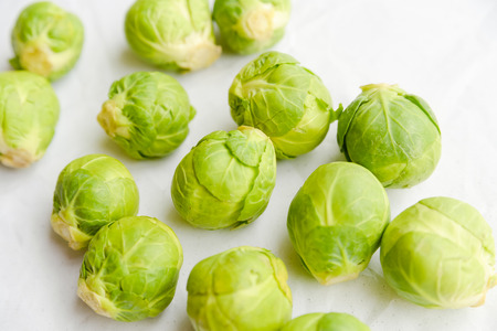 a pile of Brussels sprouts on a white backgroundの写真素材