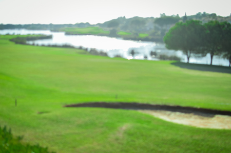 Golf field on sunny outdoors luxury lifestyle backgroundの写真素材