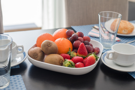 Fresh mixed fruits on plateの写真素材