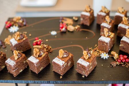Chocolate Nut Brownie Cake decorated with Strawberries in Luxury Restaurant for Brunch, Buffet Concept, Horizontal Viewの写真素材