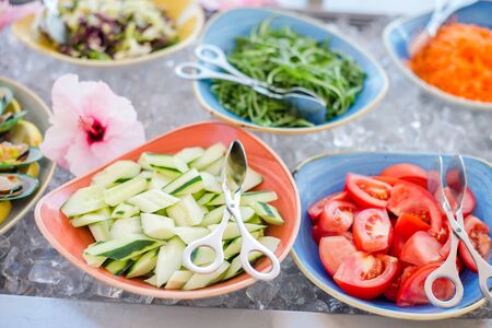 Close up of salad bar with assortment of ingredientsの写真素材