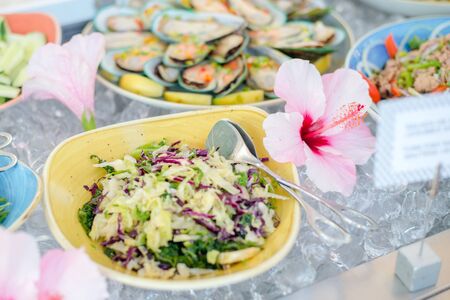 Close up of salad bar with assortment of ingredients