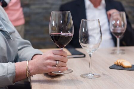 Close up on wine glasses in vineyard shop at tasting experienceの写真素材