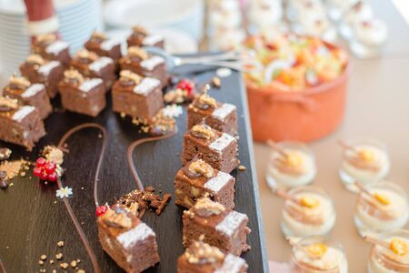 Chocolate Nut Brownie Cake decorated with Strawberries in Luxury Restaurant for Brunch, Buffet Conceptの写真素材