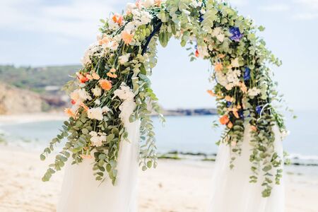 beach wedding venue, wedding setup, cabana, arch, gazebo decorated with flowers, beach wedding setupの写真素材