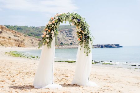 beach wedding venue, wedding setup, cabana, arch, gazebo decorated with flowers, beach wedding setupの写真素材