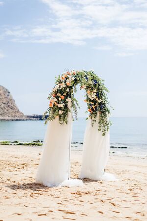 beach wedding venue, wedding setup, cabana, arch, gazebo decorated with flowers, beach wedding setupの写真素材