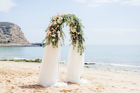 beach wedding venue, wedding setup, cabana, arch, gazebo decorated with flowers, beach wedding setupの写真素材