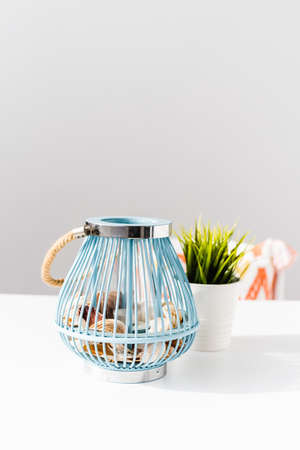 Beautiful lantern on wooden table in autumn terrace