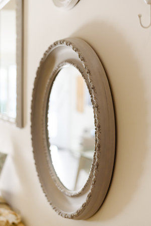 Part of the wooden white ornate, carved mirror frame in ancient style.の写真素材