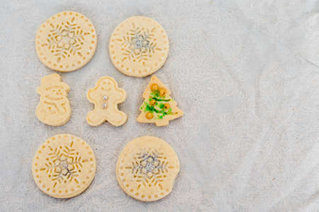 Traditional almond cookie with sugar, spices, and vintage rolling pin on rustic, on natural linen background. Top view still life with natural light.の写真素材