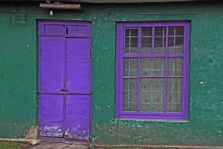 Violet door and window and matte white bulb. Village Bush Yampolsky region Vinnytsia region, Ukraineの写真素材