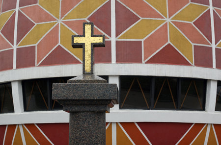 Cross against the backdrop of the museum of Pysanka (Easter Eggs) in Kolomyia, Ukraine. March 15, 2017のeditorial素材