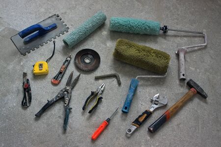 Various old tools work on a dirty floor