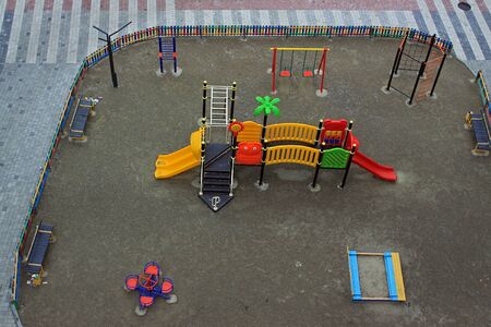 Modern colorful children playground equipment in the city. View from aboveの写真素材