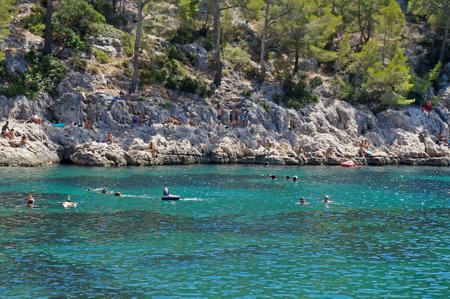 Rest on a rocky beach in the Calanc National Park in the department of Bouches-du-RhÃ´ne, France. July 25, 2020. Editorial photoのeditorial素材