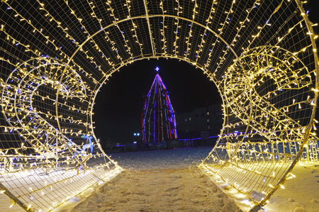 Christmas and New Year installation in Tysmenytsia, Ivano-Frankivsk region of Ukraine. December 24, 2021. Editorial photo. Shooting in evening in poor lighting conditions with high ISO valuesのeditorial素材
