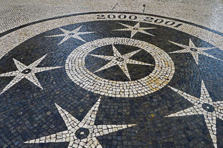 Traditional portuguese stone mosaic calcade with basalt and limestone on Lisbon, Portugalの写真素材