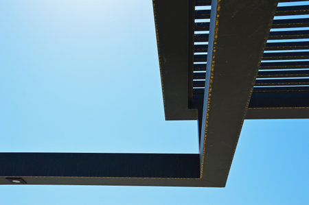 A dark metal construction against a cloudless skyの写真素材