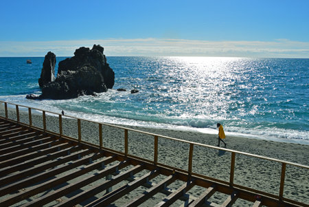 Person on a deserted beachの写真素材