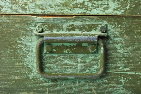 the handle on green old wooden boxの写真素材