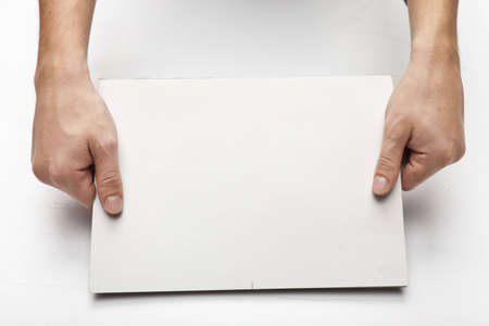 hands with paper isolated on whiteの写真素材