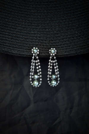 Long earrings isolated on the black backgroundの写真素材
