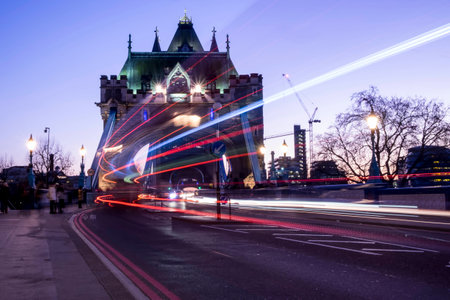 Light trails of a London Bus going over the iconic Tower Bridgeの写真素材
